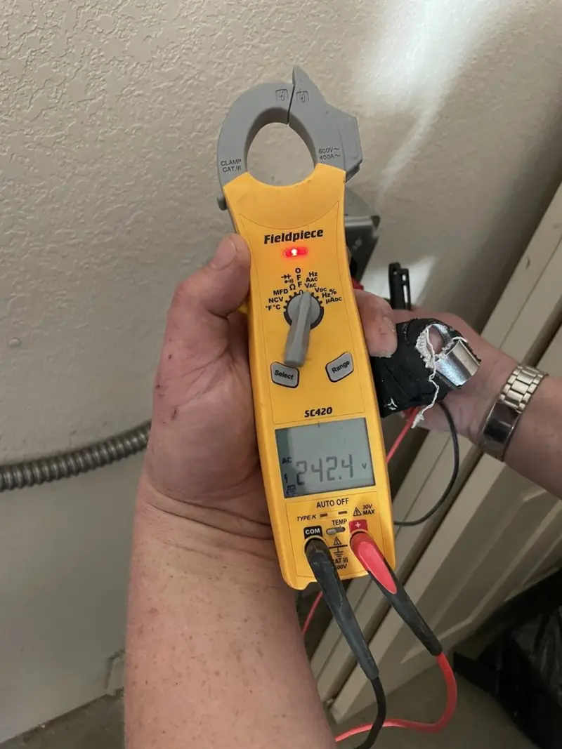Voltage testing with clamp meter during Ceiling Fan Installation in Germantown